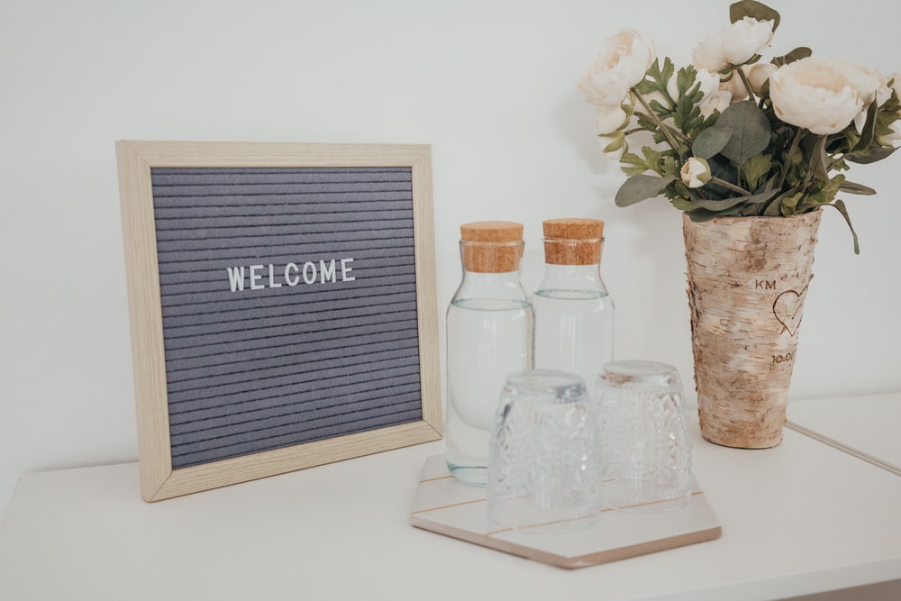 A welcome sign inside a newborn photography studio.